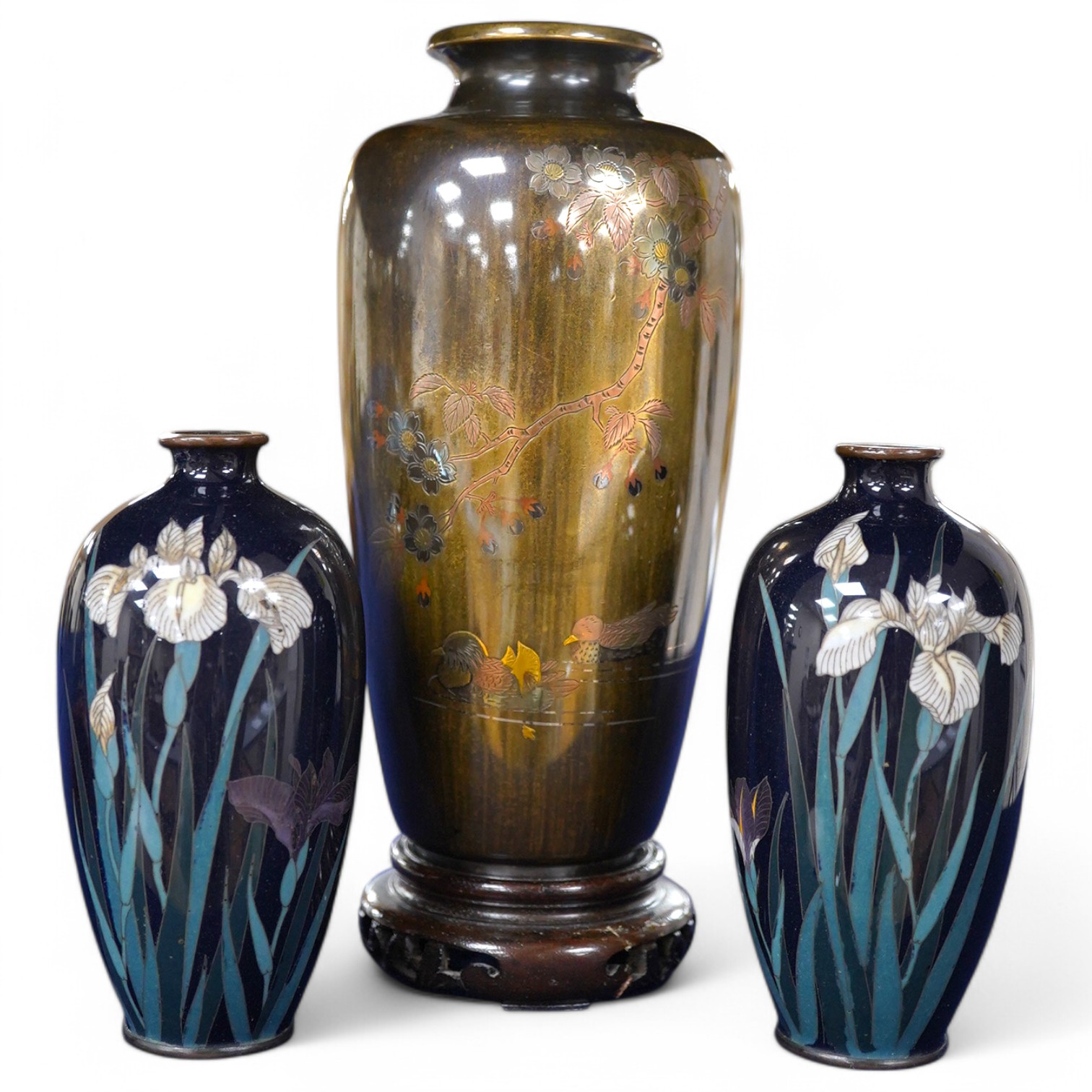 A Japanese presentation bronze and mixed metal vase on hardwood stand and a pair of cloisonne enamel vases (3), tallest 20cm. Condition - fair to good
